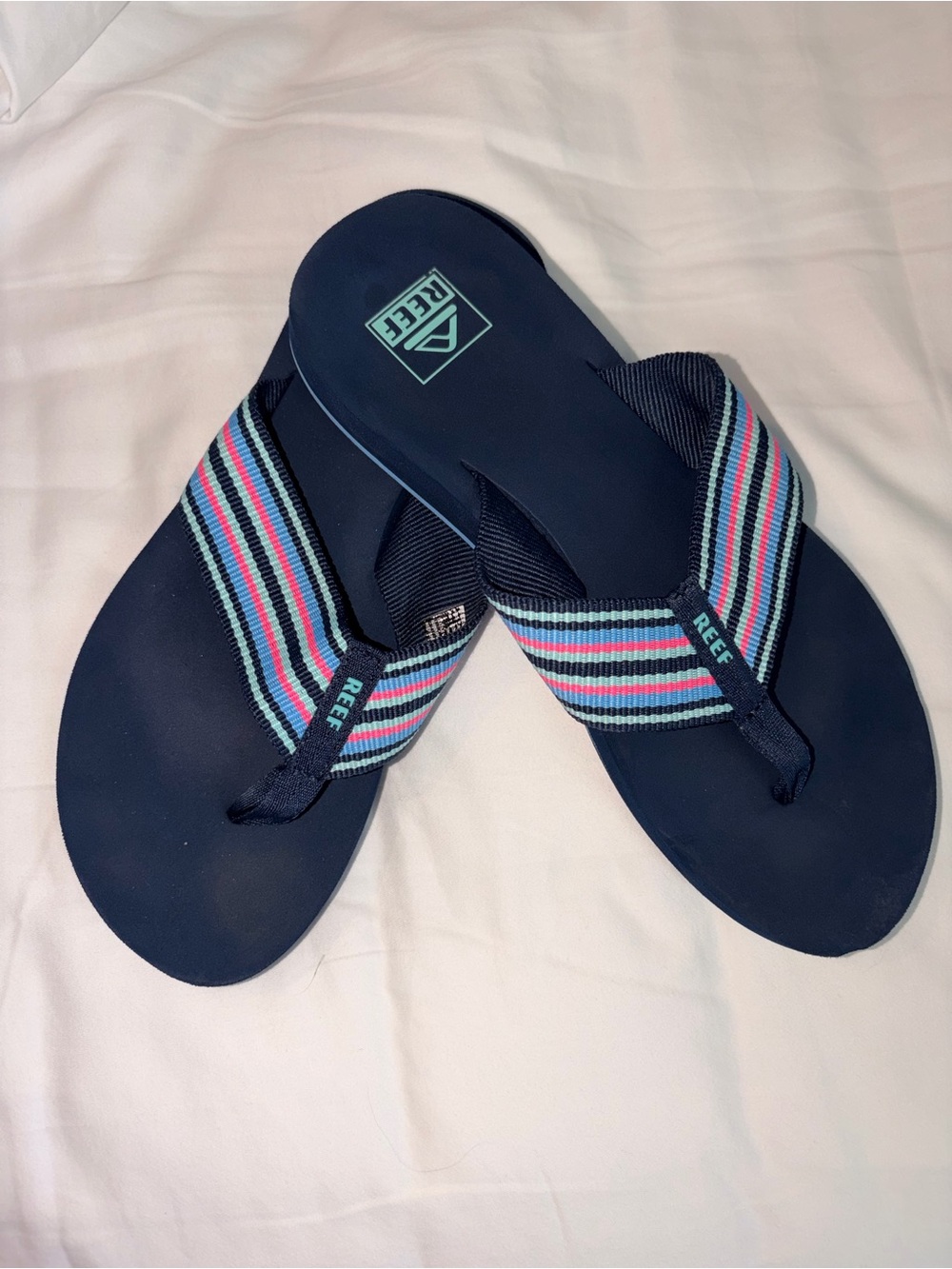 Reef Navy Flip Flops with Blue, Pink, Aqua Striped Webbing